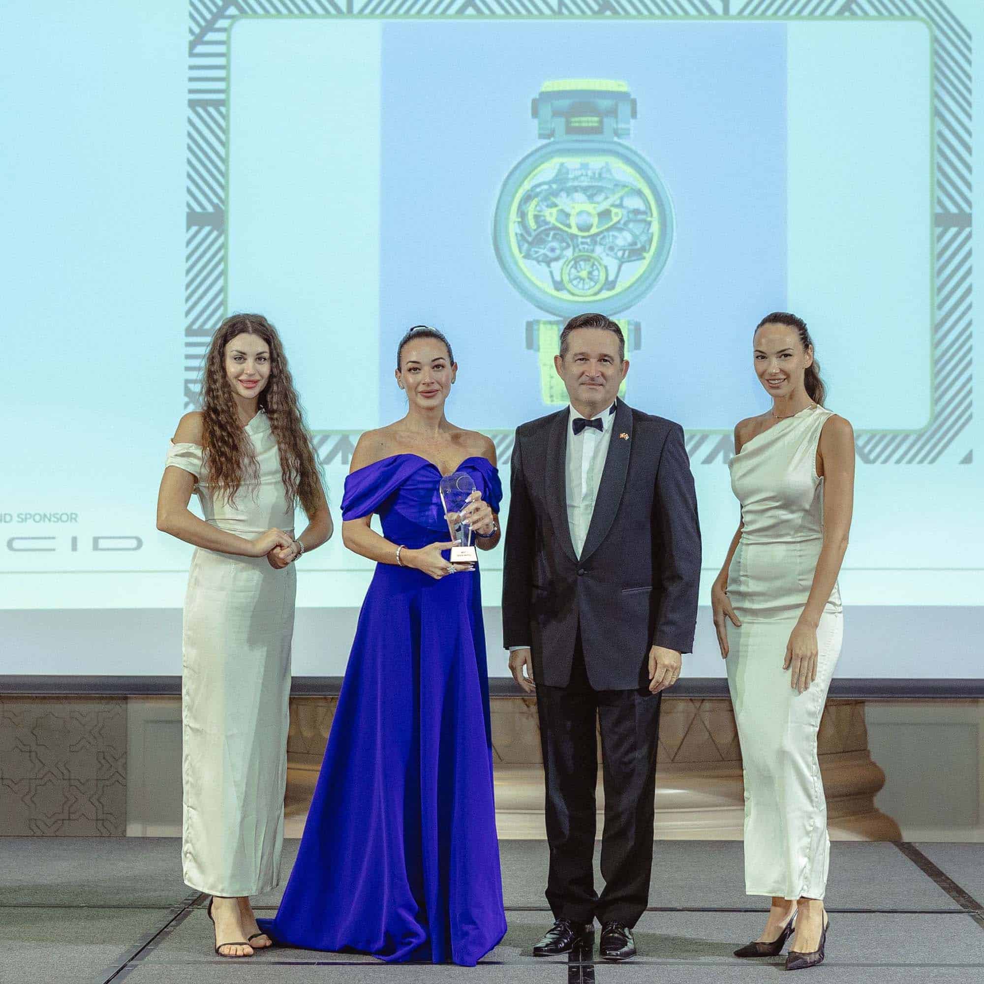 Elegant group of four at an award ceremony, celebrating the BOVET x Pininfarina Aperto 1 winning Bes.